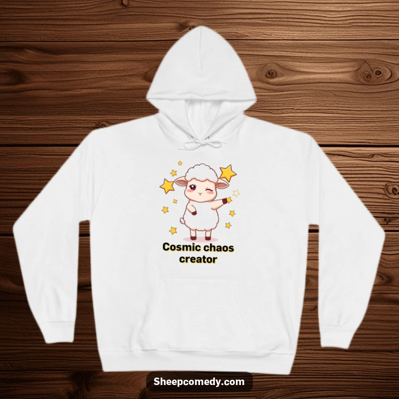 Funny hoodie showcasing a winking sheep expertly juggling bright stars, offering warm and humorous cosmic vibes.