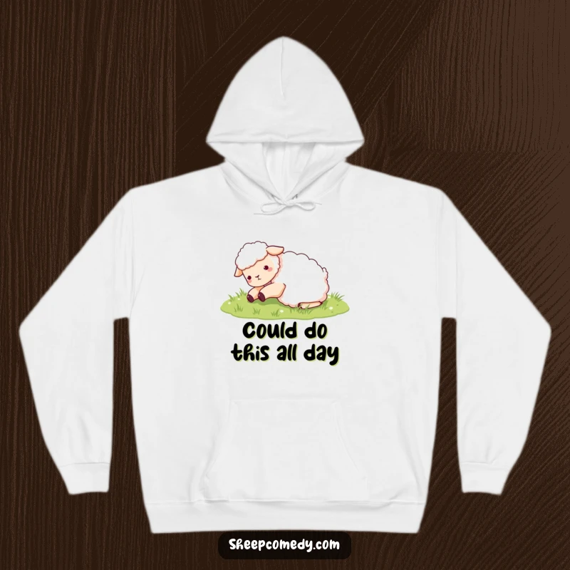 Funny Sheep Hoodie: A delighted sheep character enthusiastically rolling around in a soft patch of green grass, looking utterly content.