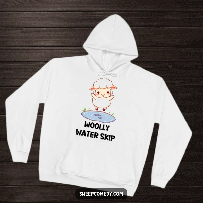 Funny hoodie showcasing a fluffy, woolly sheep playfully jumping over a small puddle, perfect for cozy days.