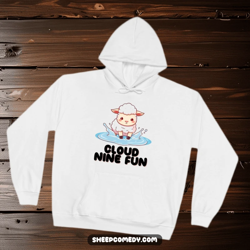 Funny hoodie showcasing a sheep character playfully splashing in a puddle of bright blue sky, offering cozy and imaginative comfort.