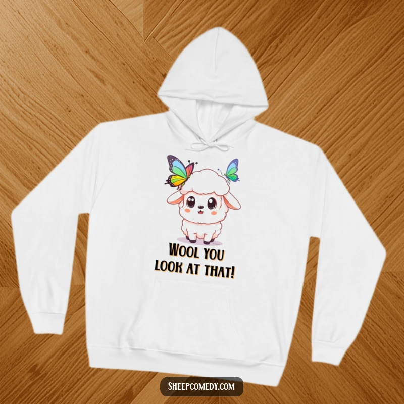 Funny sheep hoodie featuring a wide-eyed sheep captivated by a stunning rainbow butterfly, perfect for cozy, enchanting relaxation.