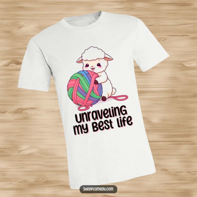 Funny Sheep T-Shirt displaying a happy sheep enthusiastically tangled in a giant, colorful ball of yarn, pure fun.