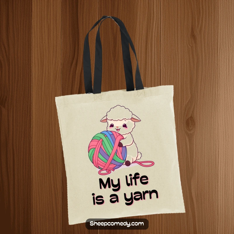 Funny Sheep Tote Bag showing a sheep happily playing with a gigantic, multi-colored ball of yarn, a scene of pure mirth.